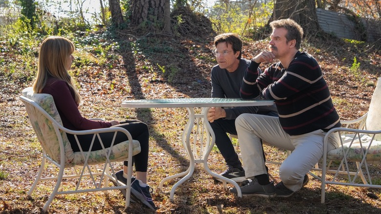 Carol talking to Clark and Floyd in a backyard on DTF St. Louis