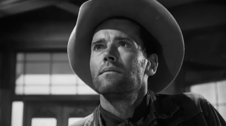 Henry Fonda's Gil Carter is seen from a low angle as he stands in a saloon in the Ox-Bow Incident