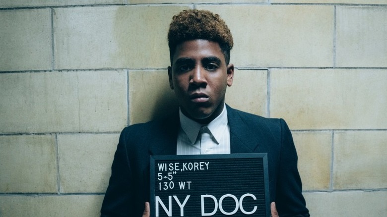 Korey taking his mugshot on When They See Us