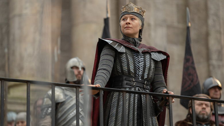 Emma D'Arcy as Rhaenyra Targaryen standing in her chainmail armor and crown in House of the Dragon