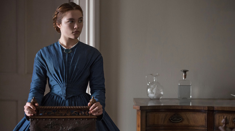 Katherine looking to her side in her home in Lady Macbeth