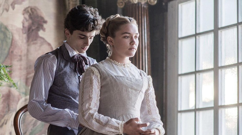 Laurie taking off Amy's apron in Little Women