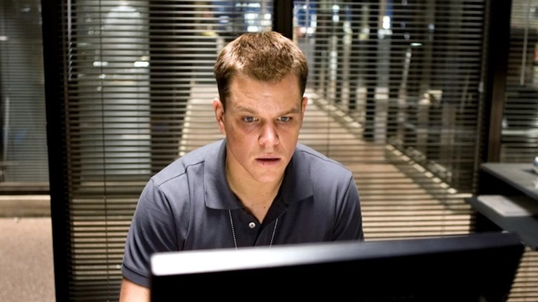 Matt Damon as Colin Sullivan scans Boston Police Department computer in The Departed