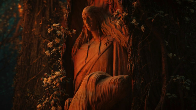 A statue of Lúthien and the talking dog Huan in The Rings of Power