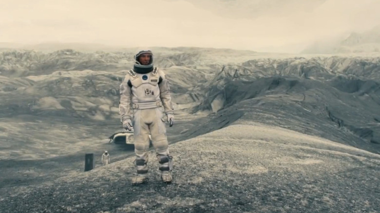 Cooper standing on a planet in Interstellar