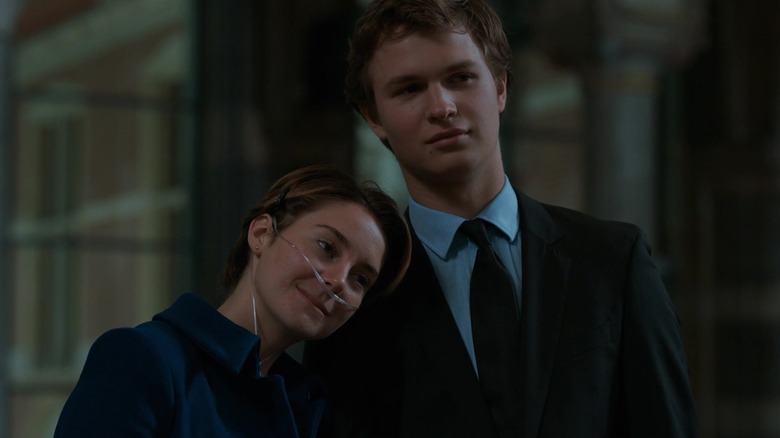 Shailene Woodley's Hazel Grace Lancaster lays her head on the shoulder of Ansel Elgort's Augustus Waters in The Fault in Our Stars