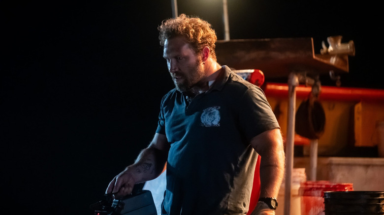 Tucker on his boat in Dangerous Animals