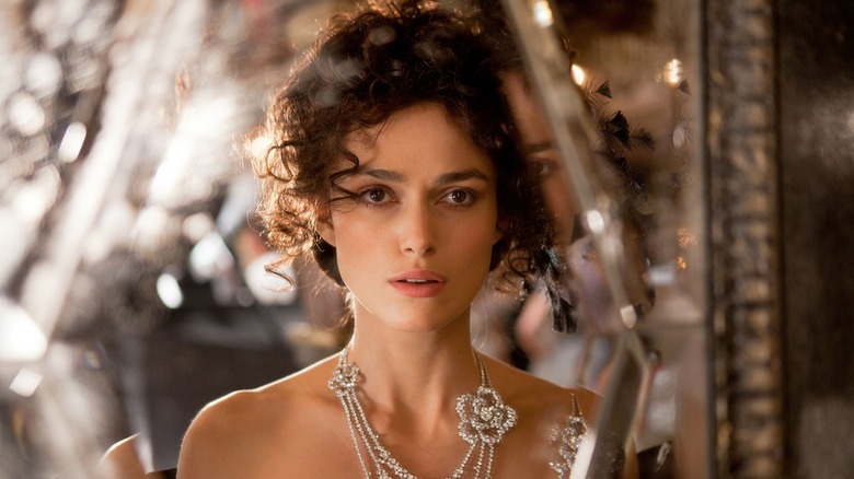 Anna with her hair up wearing a lot of jewelry in Anna Karenina (2012)