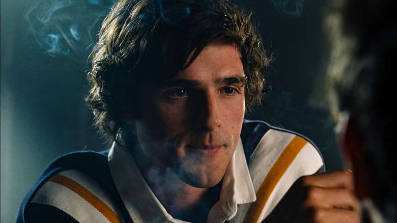 Felix talking to Oliver in a pub and smoking in Saltburn