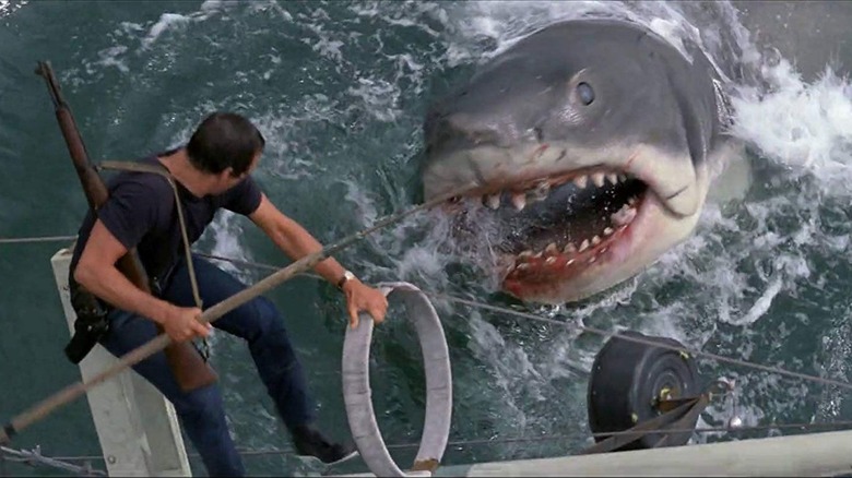 Brody holding a spear over the shark in Jaws