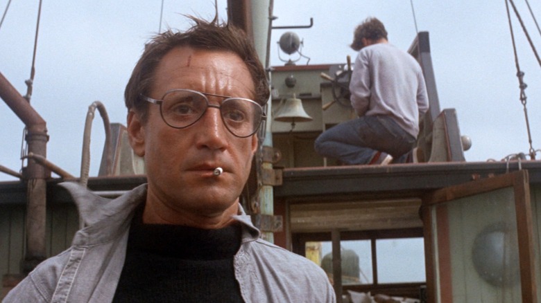 Brody on the boat with a cigarette in his mouth in Jaws