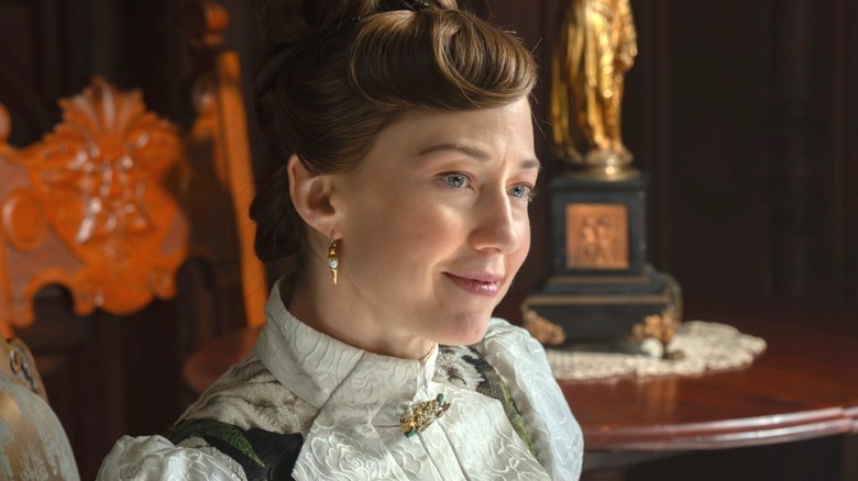 Bertha smirking at someone in The Gilded Age
