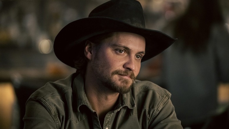 Kaycee looking at someone wearing a cowboy hat in Marshals
