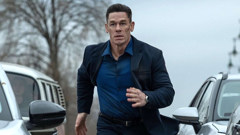 Sean running between two cars in Matchbox: The Movie