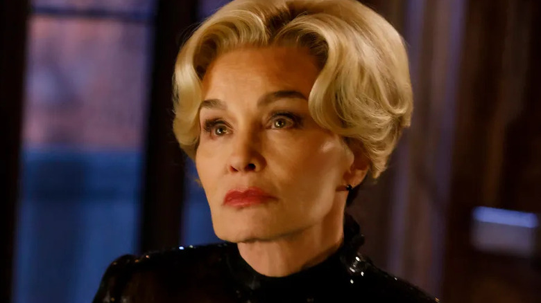 Fiona in a black outfit looking serious in American Horror Story 13