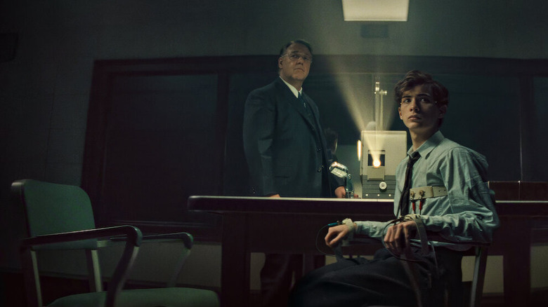 Henry Murray showing young Ted something on a projector in Unabomber
