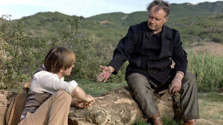Willie talking to Carl with a palm tattoo in The Illustrated Man