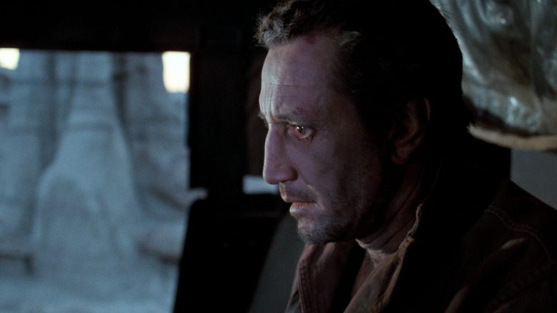 Jackie Scanlon sitting in truck driver's seat, looking haunted, in Sorcerer