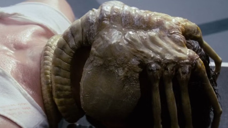 Kane with an alien facehugger on his face in Alien