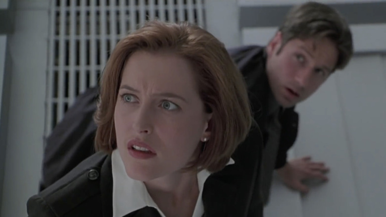 Scully and Mulder look horrified in The X-Files: Fight the Future