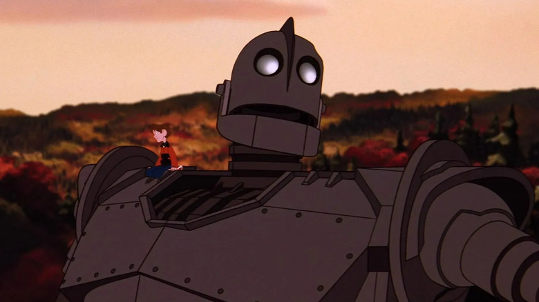 Hogarth sitting on The Iron Giant's shoulder in The Iron Giant