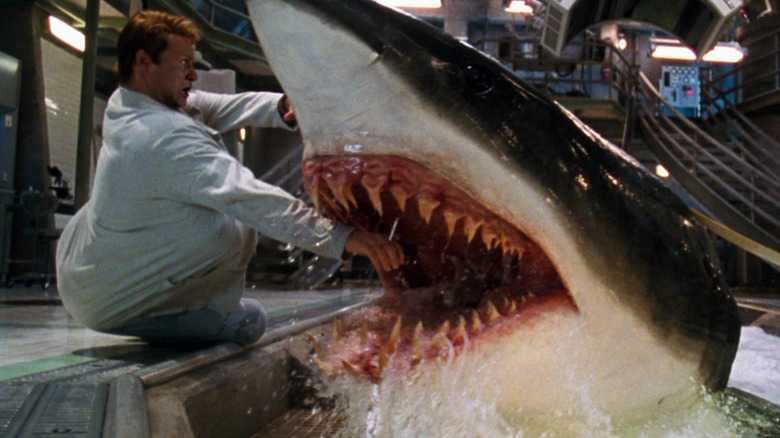 Stellan Skarsgård as Jim about to get his arm bitten off by a shark in Deep Blue Sea