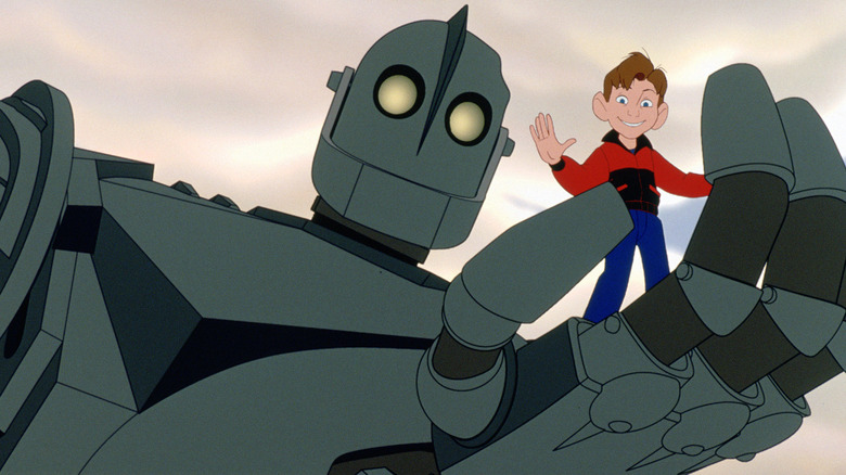 The Iron Giant holding Hogarth in his hand in The Iron Giant