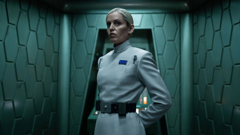 Denise Gough as Deedra Mero in her Imperial uniform in a hallway on Andor