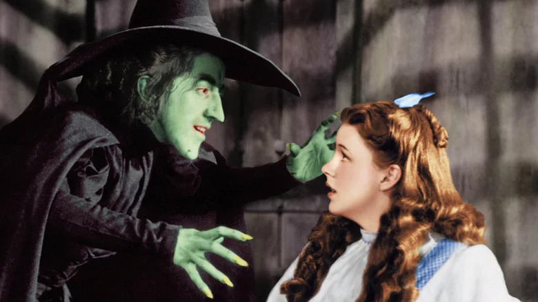 Margaret Hamilton's Wicked Witch of the West facing Judy Garland's Dorothy Gale in The Wizard of Oz