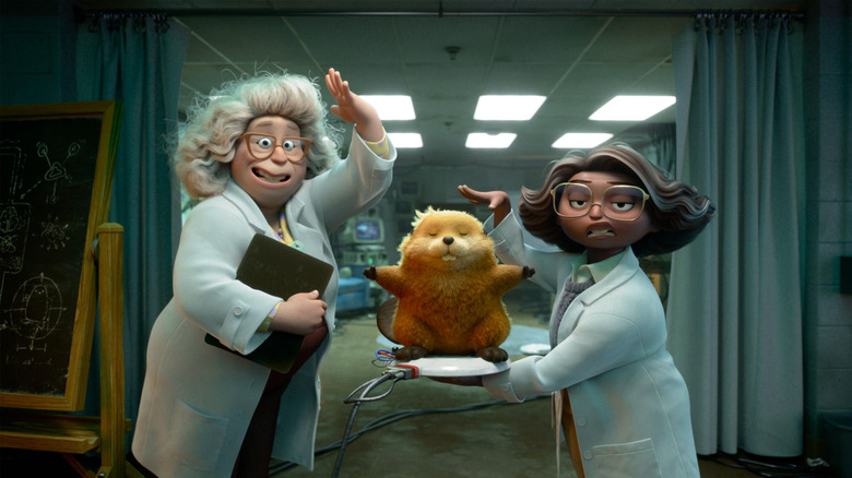 Two scientists holding a robotic beaver in Hoppers