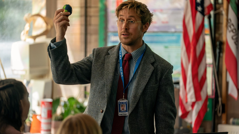 Ryan Gosling as Ryland Grace standing in a classroom and teaching young students in Project Hail Mary