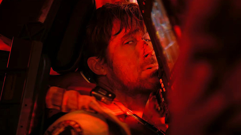 Ryan Gosling as Ryland Grace with his head smashed against a computer console in Project Hail Mary