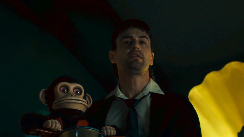 Bill holding the Monkey in The Monkey