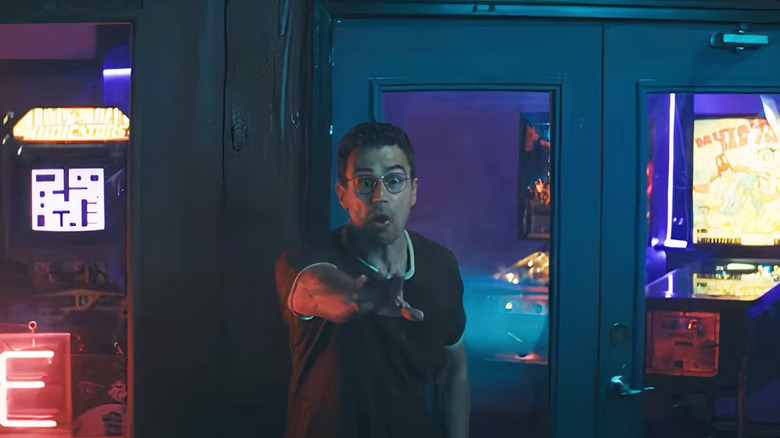 Hal in a panic in front of a pinball machine in The Monkey