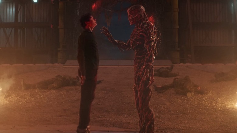 Will Byers (Noah Schnapp) being held up off the ground by Vecna (Jamie Campbell Bower) in Stranger Things