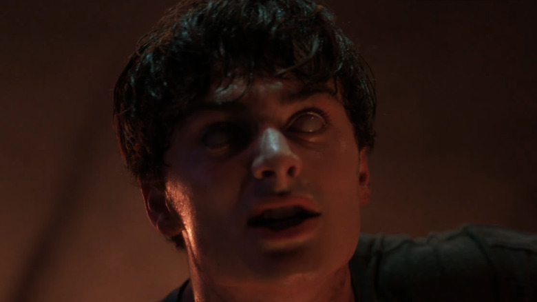 Noah Schnapp's Will Byers is seen in a trance with his eyes glazed over in Stranger Things