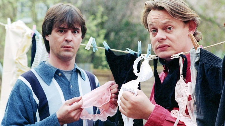 Neil Morrissey as Tony and Martin Clunes as Gary stealing some underwear in Men Behaving Badly