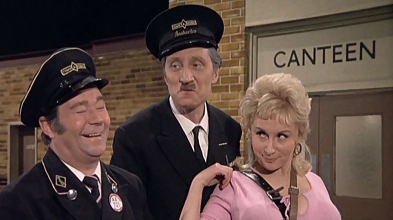 Reg Varney as Stan and Stephen Lewis as Blakey with a young woman in On the Buses