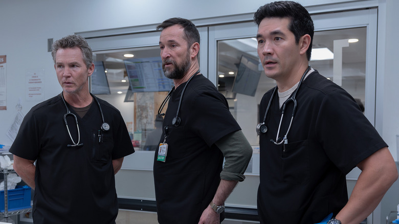 Abbot Robby and Shen looking at something on The Pitt