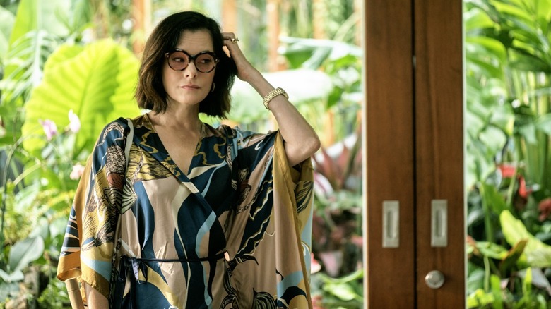 Victoria wearing sunglasses inside and a kaftan on The White Lotus