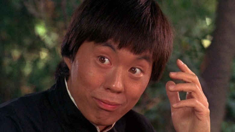 Loo smiling in the Fistful of Yen segment from The Kentucky Fried Movie
