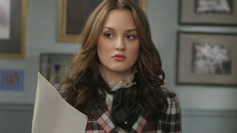 Blair holding a paper and looking suspicious on Gossip Girl