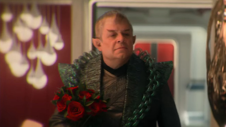 A Vulcan holding a bouquet of roses in Star Trek: Strange New Worlds