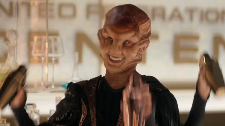 A three-armed alien bartender at a Federation bar in Star Trek: Strange New Worlds