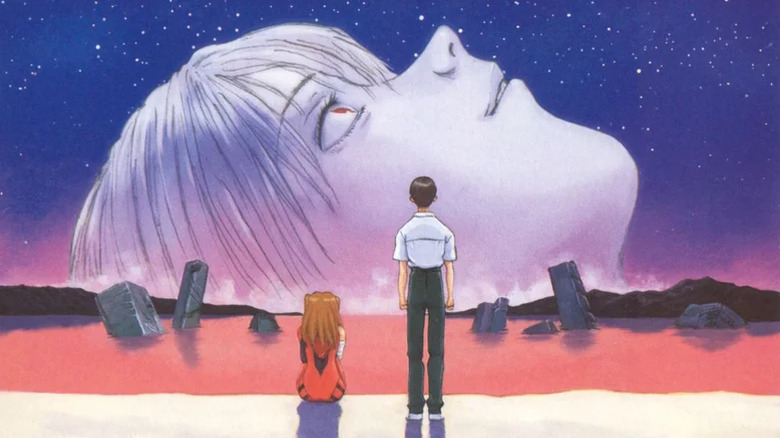Shinki and Asuka look at a giant head sticking out of the ocean in The End of Evangelion