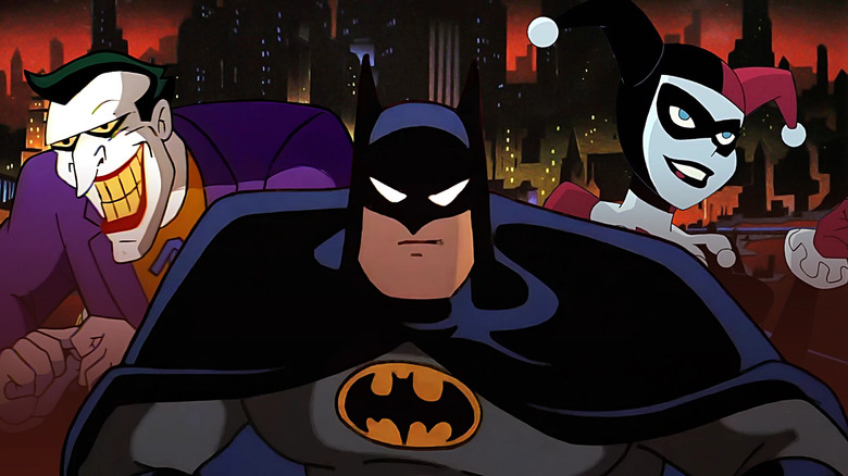 Composite image of the Joker, Batman, and Harley Quinn from Batman: The Animated Series with Gotham City in the background