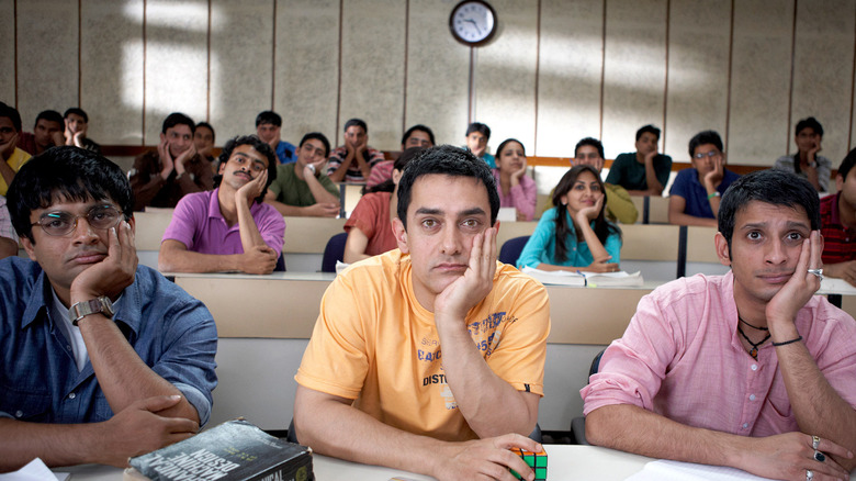 Rancho and his two buddies sitting in class, bored, in 3 Idiots