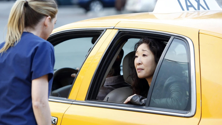 Cristina in a cab saying goodbye to Meredith on Grey's Anatomy