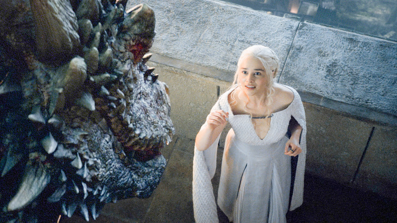 Daenerys reaching towards her dragon in Game of Thrones