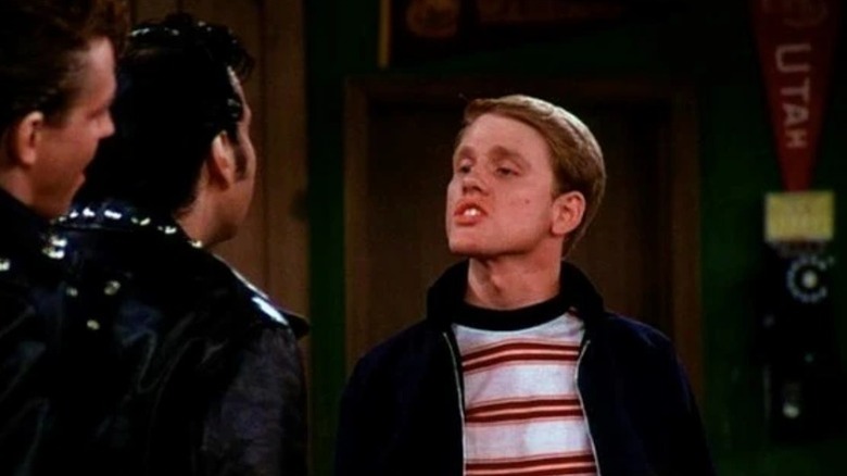 Ron Howard's Richie Cunningham facing two greasers on Happy Days